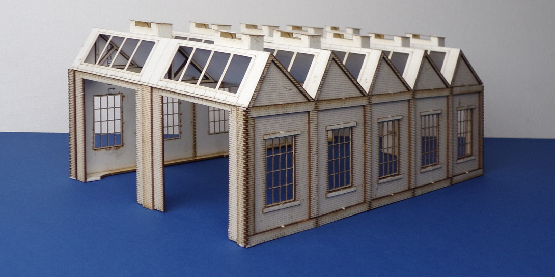 B 00-29 OO gauge north light style engine shed Double road north light style engine shed with square windows. 